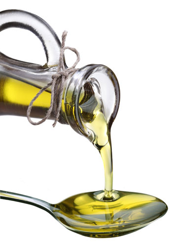 image of olive oil poured onto a spoon
